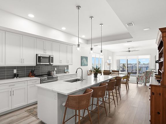 Enjoy the open-concept kitchen and dining area, offering plenty of space to cook, gather, and enjoy meals together.