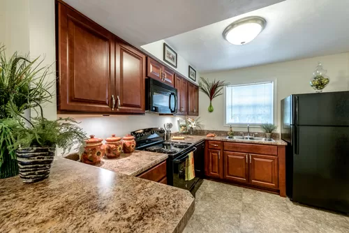 Fully equipped kitchen. - Lakefield Mews Apartments and Townhomes