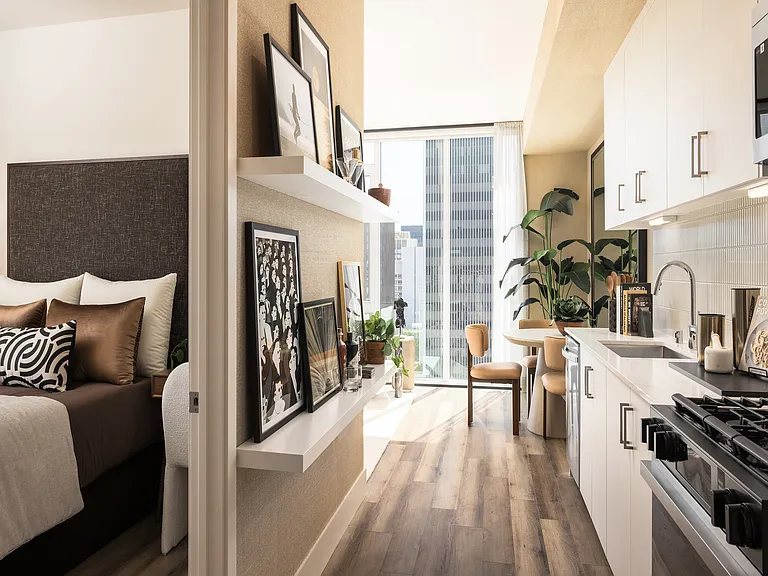 Chic urban apartment with cozy bedroom, modern kitchen, and stylish dining nook overlooking the city.
