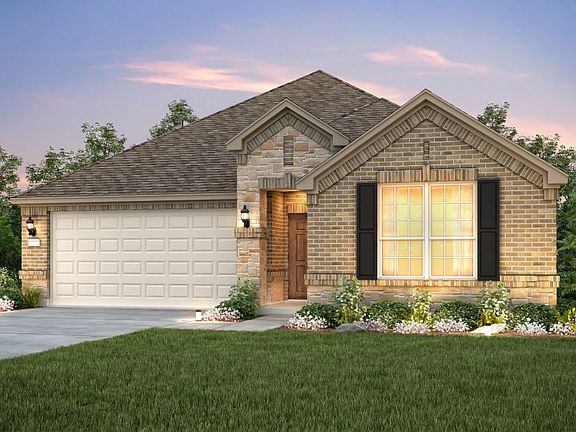 The Dayton, a one-story home with 2-car garage, shown with Home Exterior B