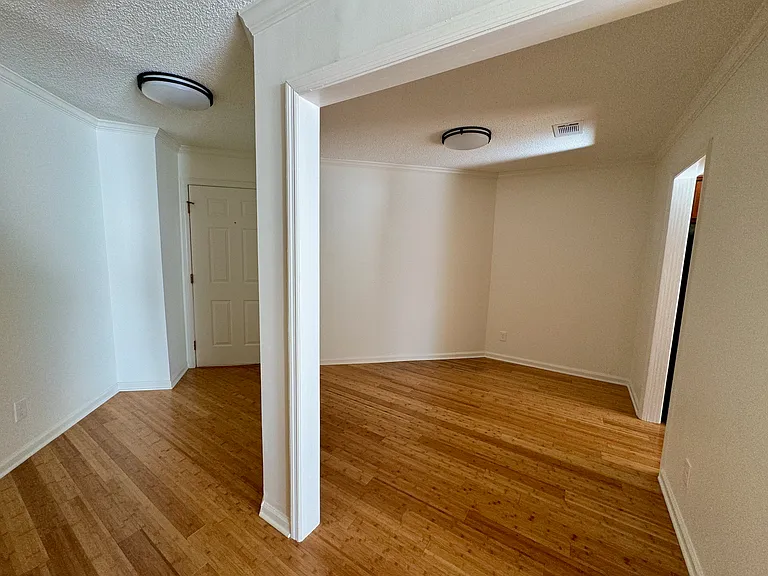 front entry hall and door at left, office/bonus room at right