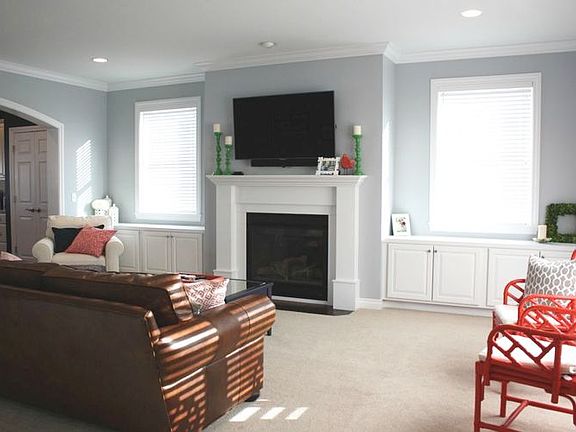 Spacious Great Room is 21x17 and features gas fireplace with custom built-ins and crown molding. Quality soft shade window treatments throughout!