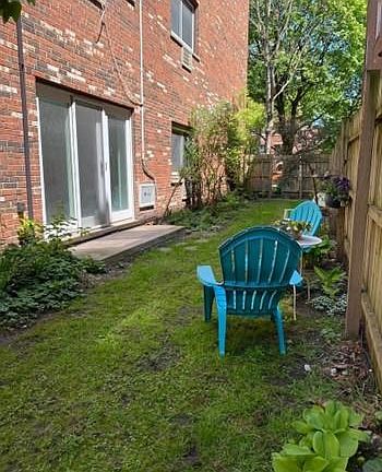 Side yard (fenced in and locked with building key)