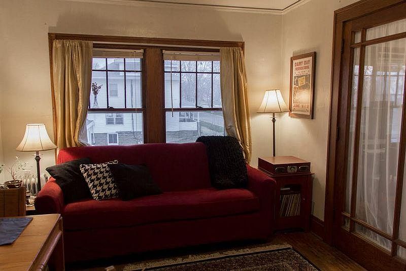 Living room sowing the french doors between the living room and the bedroom