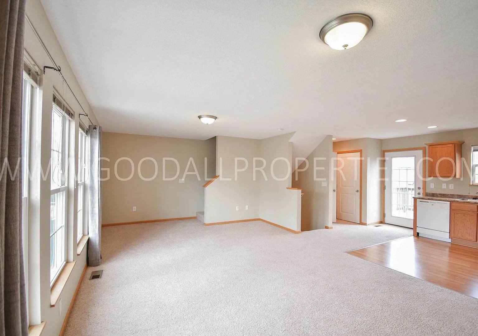 Now $1,550! Spacious Urbandale Townhome with 2-Car Garage, Deck & Lawn Care Included — Photo 2