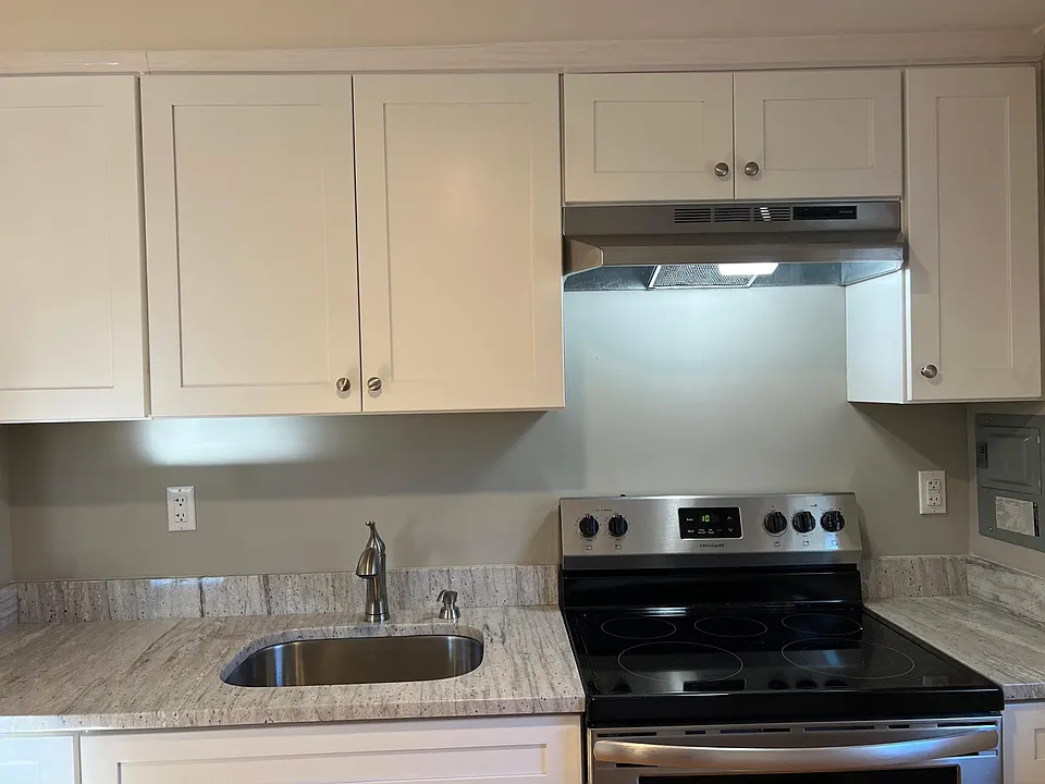 Totally renovated kitchen with stainless appliances and granite countertops