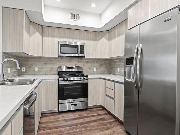 Kitchen with Stainless Steel Appliances and Ample Cabinet Storage