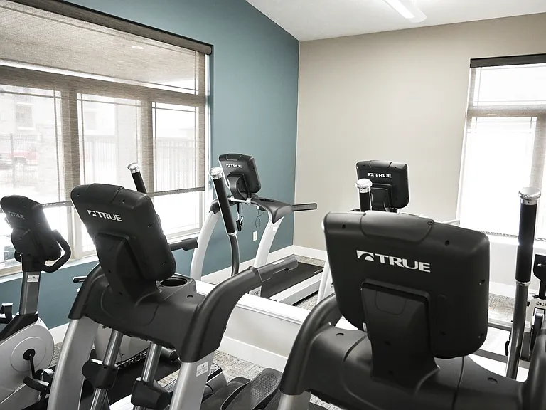 Large windows for natural light in gym at The Sterling Grand Island.