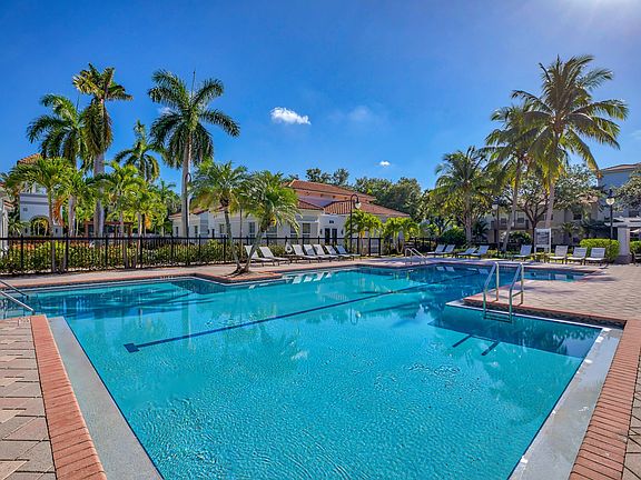 Resort-style pool with lounge areas
