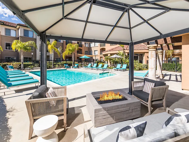 Swimming Pool and Lounge Area with a Firepit
