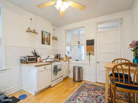 Kitchen looking out to bonus room/sun porch