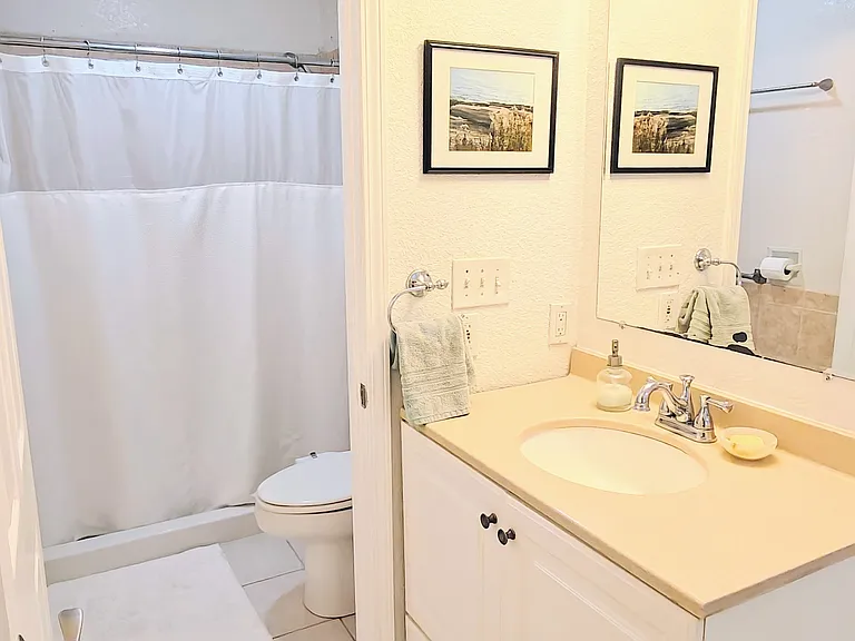 Bathroom for primary bedroom. Walk in closet to the right of the sink.