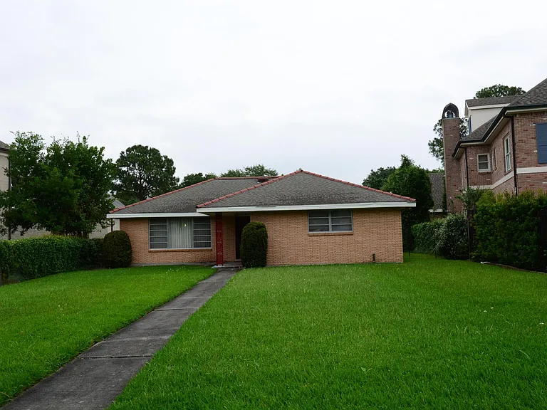 View of back of house. 100 ft. to the left of this picture is a parkway lined with oaks.