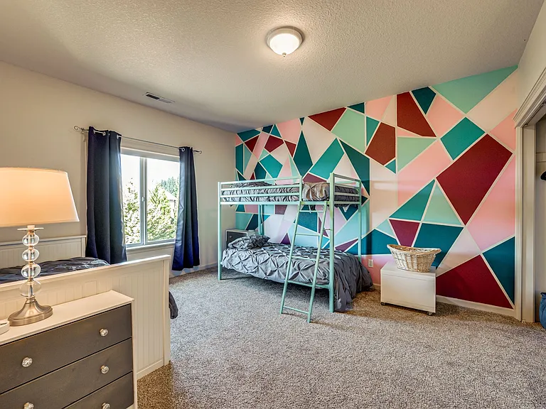 Sleep up to four in this large bedroom with bunk beds and twin bed with trundle.