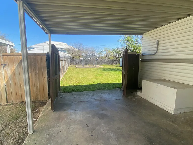 Extra large double gate to backyard.