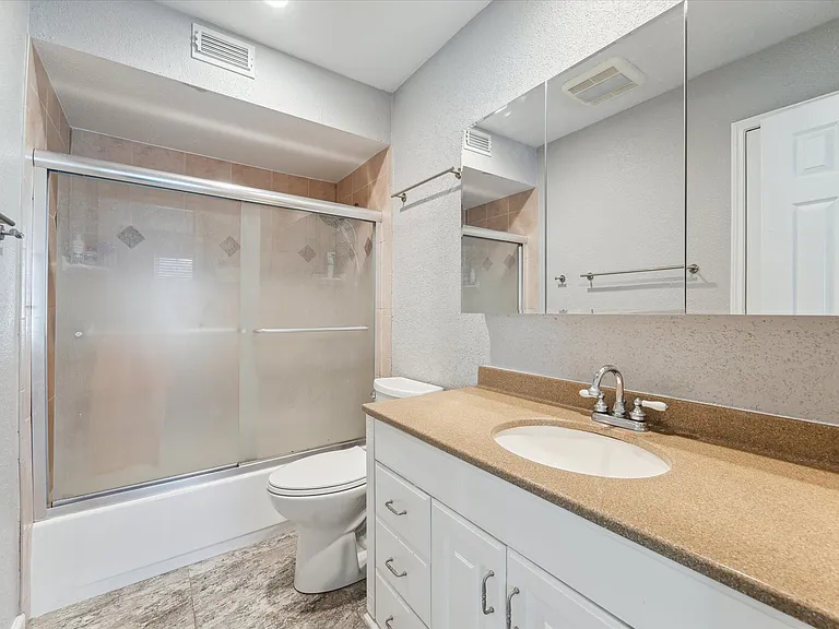 Primary bath with storage closet (not seen in photo)
