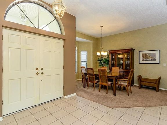 Enter thru a Spacious Foyer, Leading to the Front Living Space and Dining Room.
