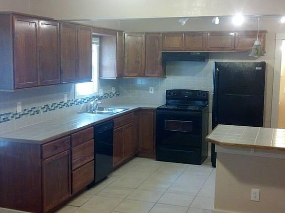 Open concept kitchen with usb charging outlets and well lit space. Breakfast bar as well.