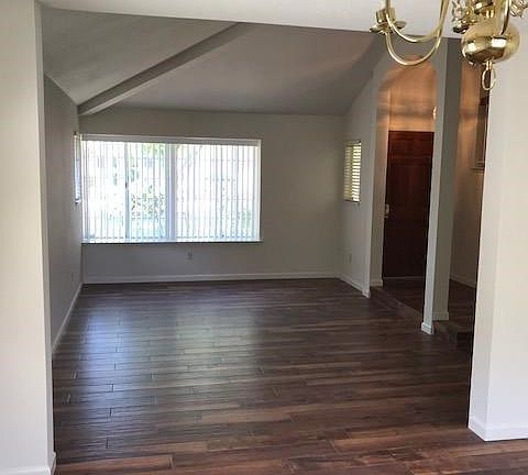 The formal living room has a volume ceiling with architectural details.