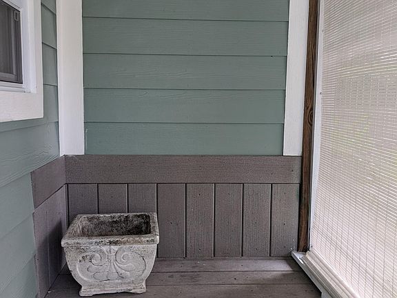 Enclosed front screened porch 5008 School LOL