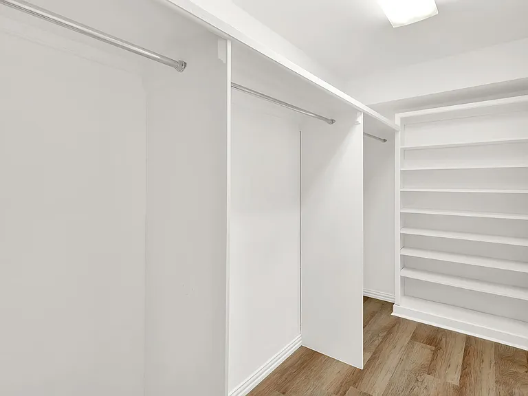 Primary bedroom walk in closet is huge with plenty of room for everyones summer and winter clothes.