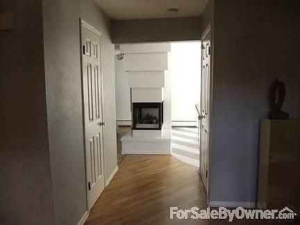 ENTRY HALL SHOWING FIREPLAC
						:
						THREE SIDED FIREPLACE