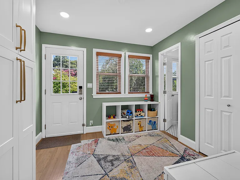 Sunroom off the back of the kitchen, looking out to the back yard and detached garage