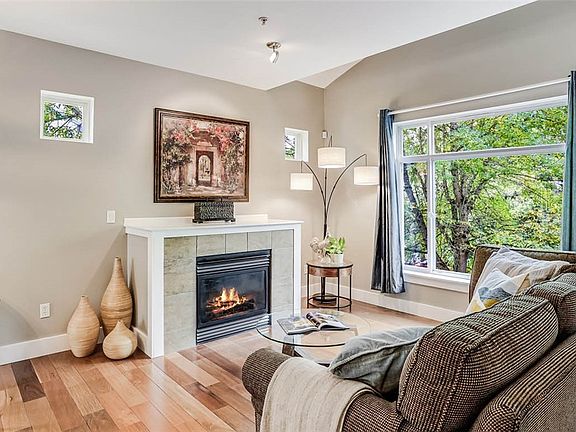 Built-in fireplace, & custom blinds throughout!