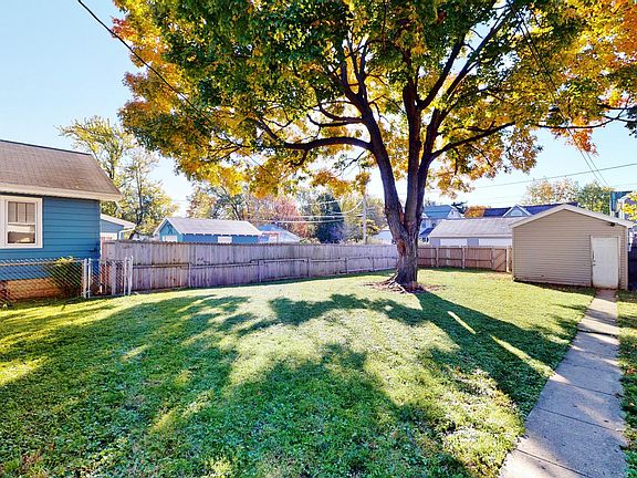 Fenced yard and garage with garage door opener.