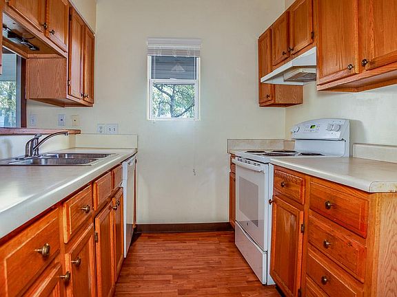Galley kitchen with pass through to living space