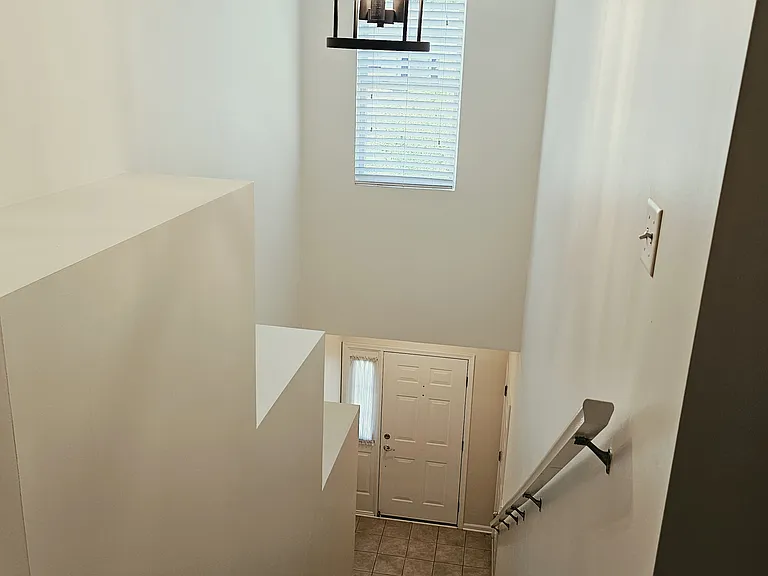 Stairs from Front Door and Garage up to home.