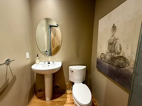 Powder room/half-bath in the hallway for guests