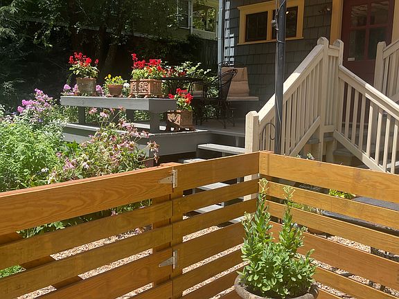 Relax on the shared deck shared decked right outside the apartment.