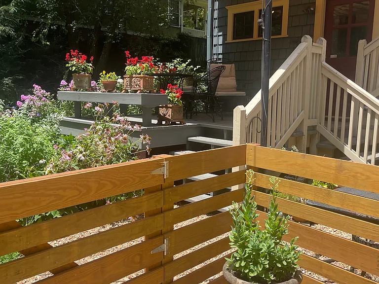 Relax on the shared deck shared decked right outside the apartment.