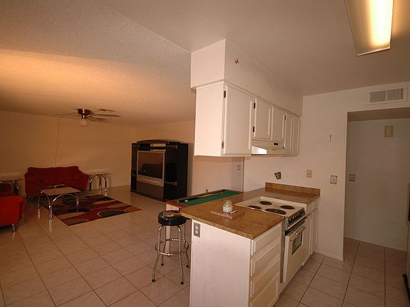 VIEW OF GREAT ROOM OFF DINING AREA