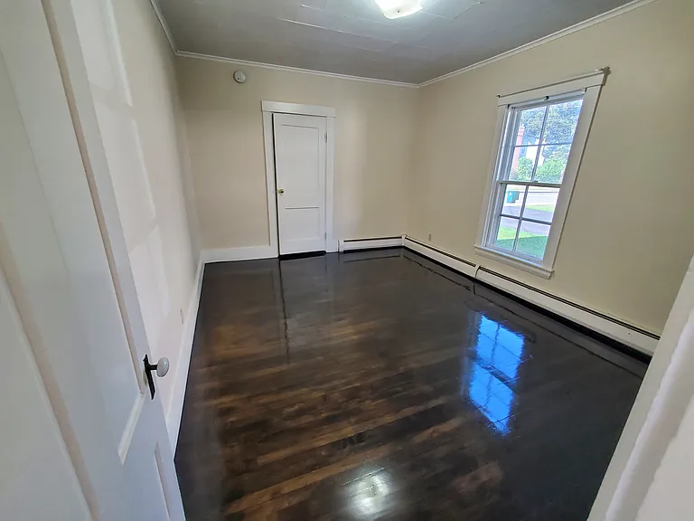 Bedroom faces west and has a refinished ebony high gloss floor