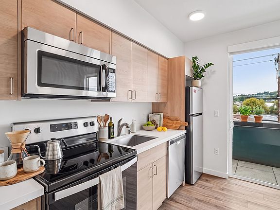 Cook with the door open - the kitchen opens directly onto your private balcony.