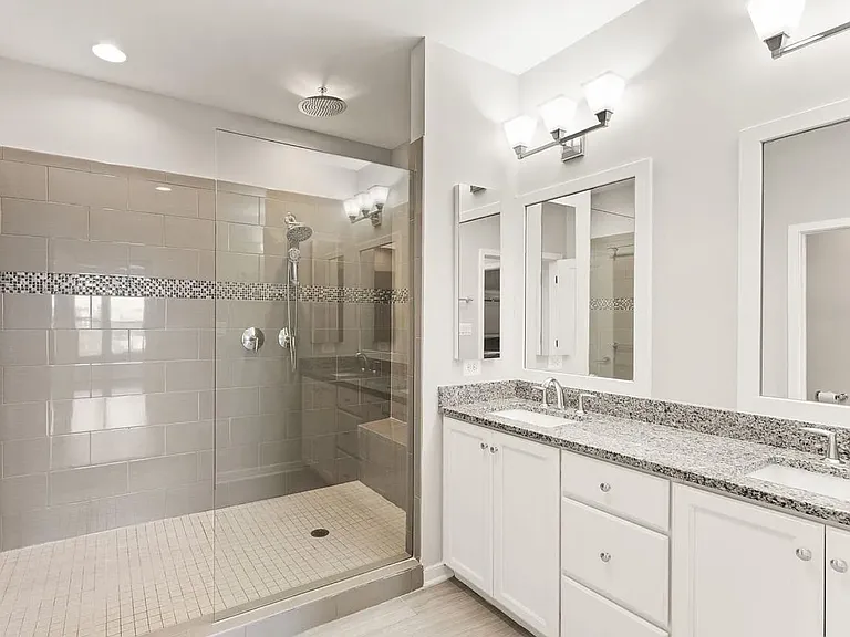 Primary bathroom, with double sinks and oversized shower.