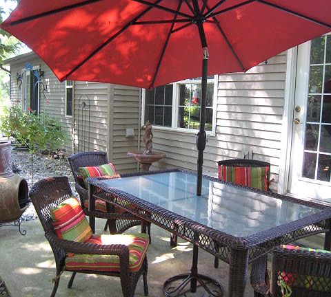 Rear patio off sunroom/den