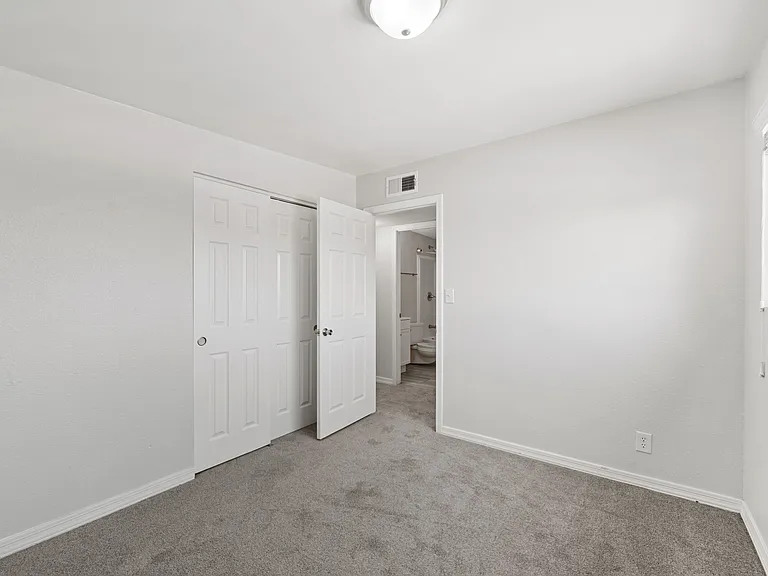 Generous closet space and easy access to the hall bath from bedroom two.