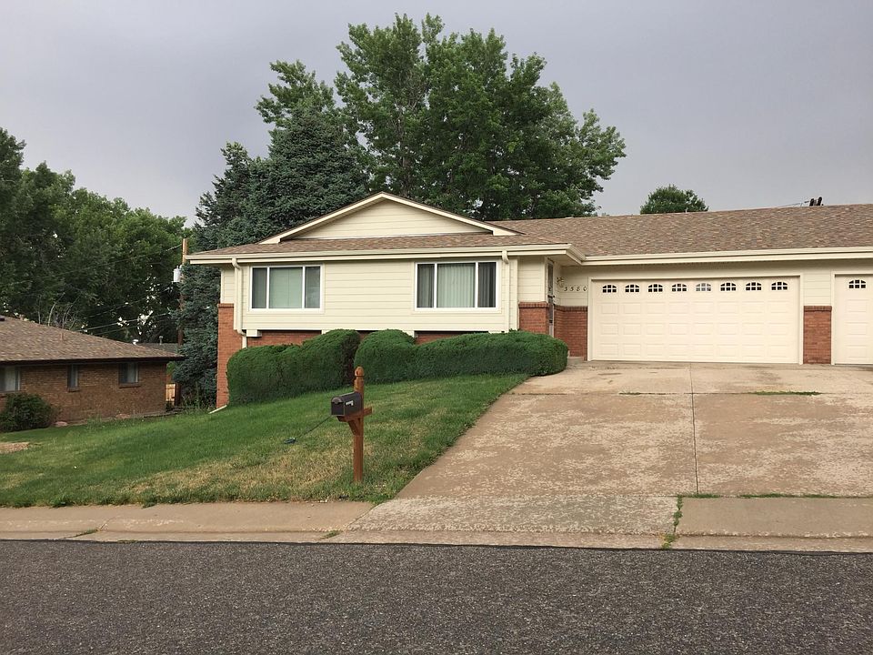 Street View of large Ranch for Lease. Paired with another Ranch. Brick & Vinyl Exterior.