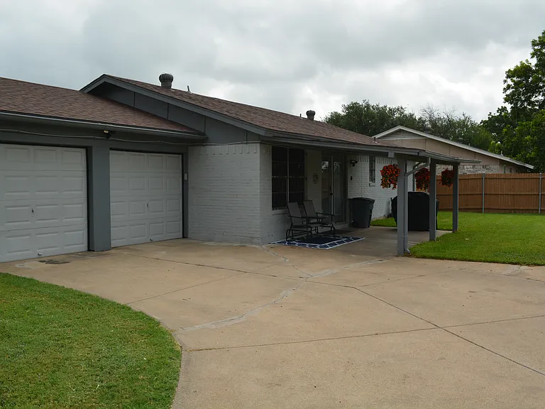 Enjoy our large driveway to fit multiple cars with-in the gated area.