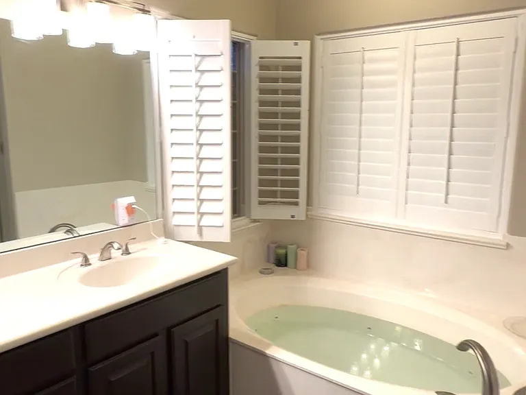 Whirlpool soaking tub in master bathroom.