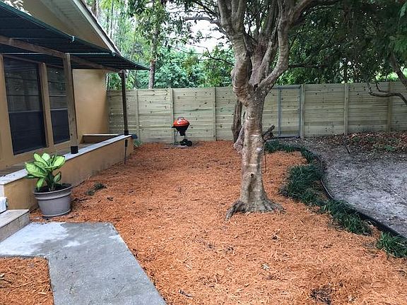 YARD AND ENTRANCE TO APT