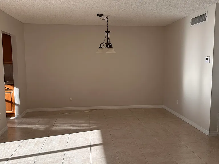 Dining room, entrance to kitchen on the left.