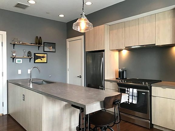 The kitchen has plenty of counter space, cabinet storage and a walk-in pantry!