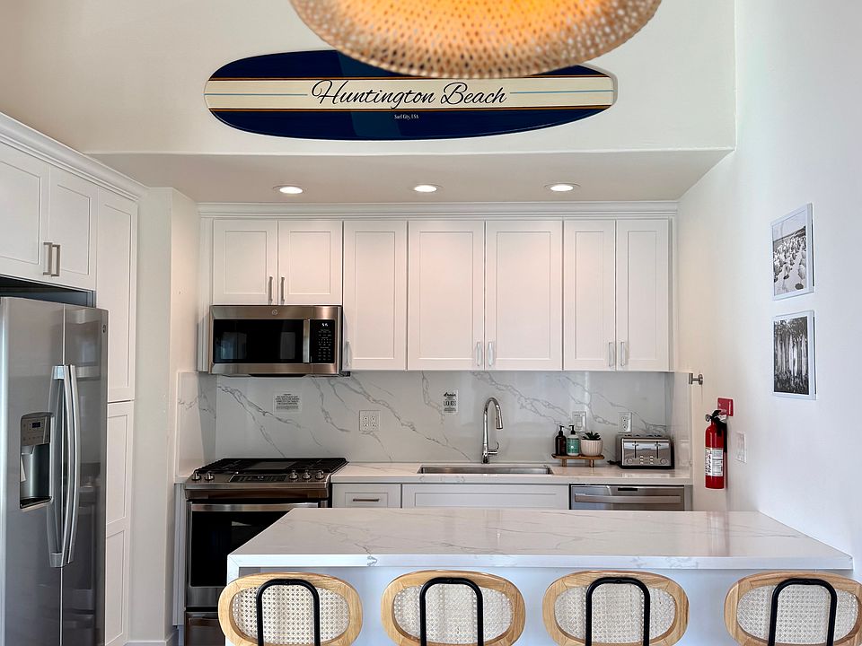 Beautiful and coastal kitchen with KitchenAid stainless steel appliances