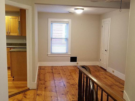 Another view of the space at the top of the stairs. View from bathroom area.