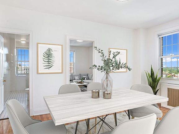 Two-bedroom apartment dining area (virtually staged)