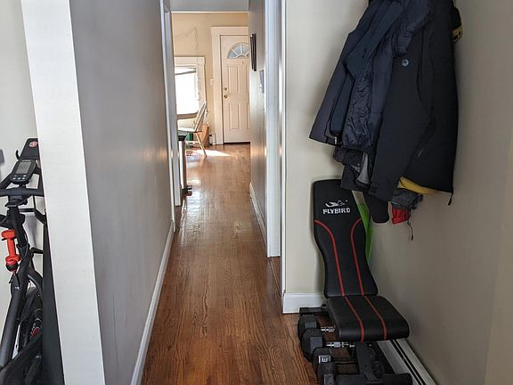 Hall from front door with living room entrance on left